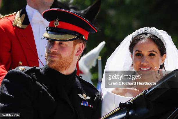 Prince Harry, Duke of Sussex and Meghan, Duchess of Sussex in the Ascot Landau carriage during the procession on The Long Walk after getting married...