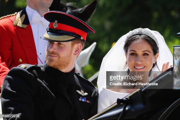 Prince Harry, Duke of Sussex and Meghan, Duchess of Sussex in the Ascot Landau carriage during the procession on The Long Walk after getting married...