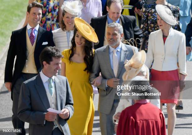 George and Amal Clooney attend the wedding of Prince Harry to Ms Meghan Markle at St George's Chapel, Windsor Castle on May 19, 2018 in Windsor,...
