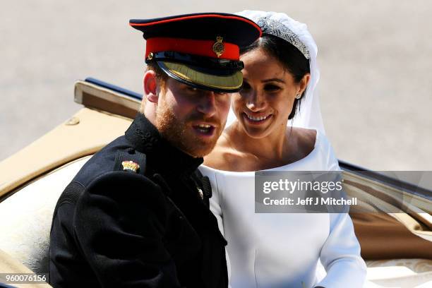 Prince Harry, Duke of Sussex and the Duchess of Sussex in the Ascot Landau carriage during the procession on The Long Walk after getting married St...