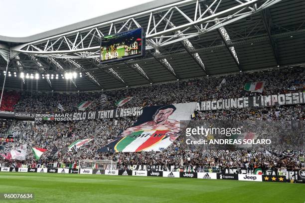 Juventus' supporters deploy a giant flag in honor of goalkeeper Gianluigi Buffon before the Italian Serie A football match Juventus versus Verona, on...