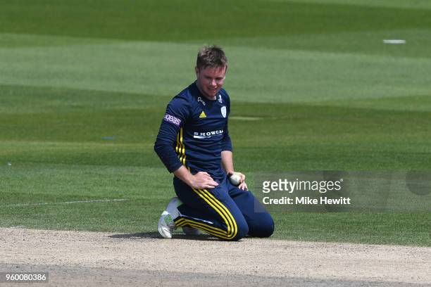 Mason Crane of Hampshire reacts after failing to hang on to a caught and bowled chance offered by Harry Finch on 98 during the Royal London One-Day...