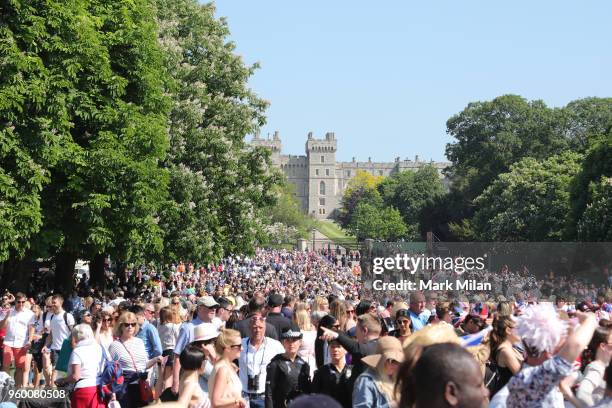 Wellwishers attend the wedding of Prince Harry to Ms. Meghan Markle at Windsor Castle on May 19, 2018 in Windsor, England. Prince Henry Charles...