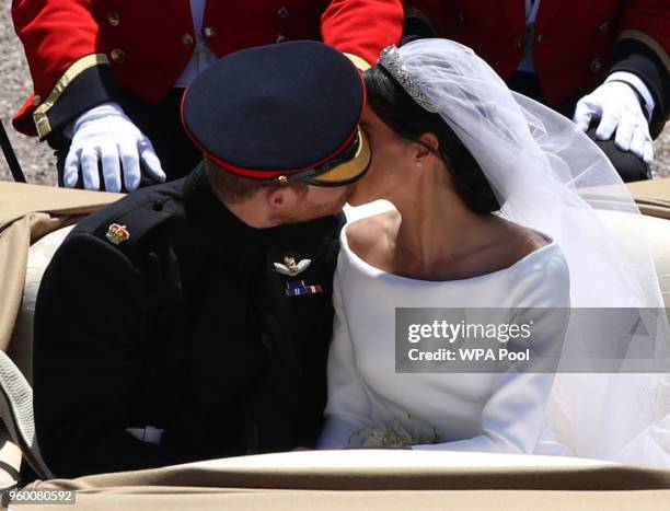 Prince Harry, Duke of Sussex and The Duchess of Sussex leave Windsor Castle in the Ascot Landau carriage during a procession after getting married at...