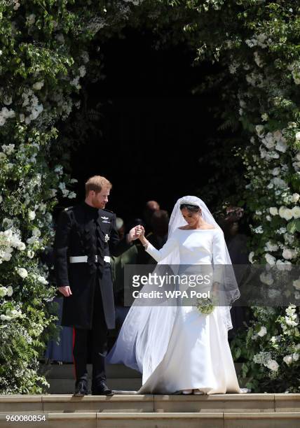Prince Harry, Duke of Sussex and The Duchess of Sussex leave St George's Chapel, Windsor Castle after their wedding ceremony on May 19, 2018 in...