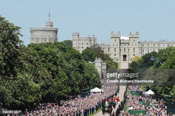 Prince Harry, Duke of Sussex and Meghan, Duchess of Sussex head up The Long Walk back into Windsor Castle in the Ascot Landau carriage during the...