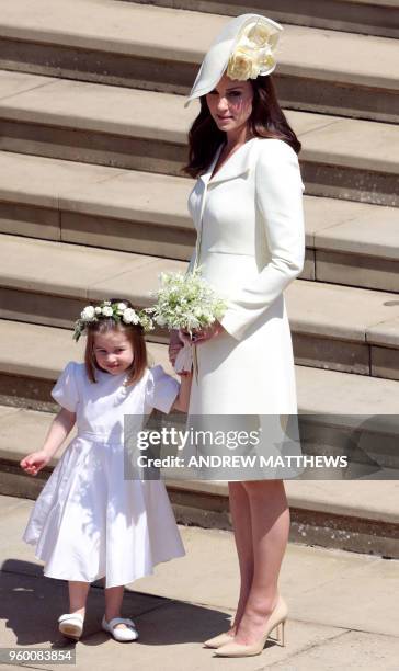 Britain's Catherine, Duchess of Cambridge leaves with her daughter Princess Charlotte after attending the wedding ceremony of Britain's Prince Harry,...