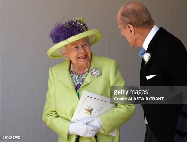 Britain's Queen Elizabeth II talks with Britain's Prince Philip, Duke of Edinburgh as they leave after attending the wedding ceremony of Britain's...