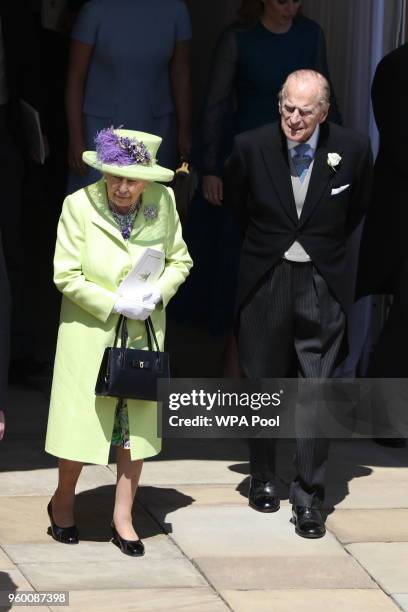 Queen Elizabeth II and Prince Philip, Duke of Edinburgh walk through the Galilee Porch after the wedding of Prince Harry and Meghan Markle at St...