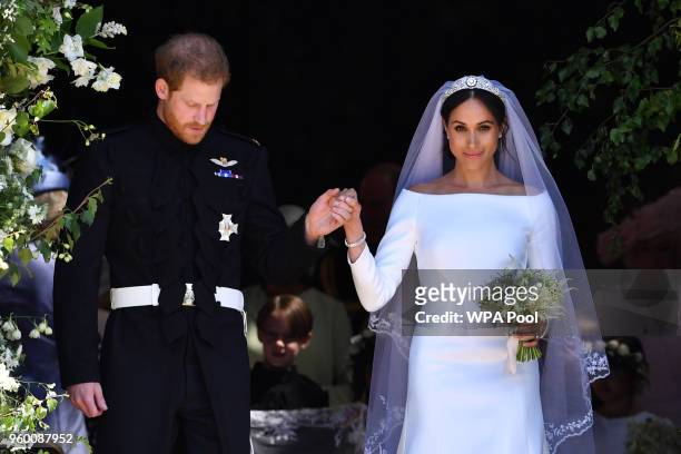 Britain's Prince Harry, Duke of Sussex and his wife Meghan, Duchess of Sussex leave from the West Door of St George's Chapel, Windsor Castle, in...
