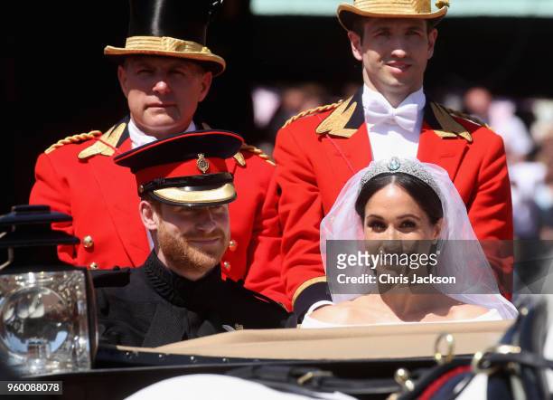 Prince Harry, Duke of Sussex and Meghan, Duchess of Sussex leave Windsor Castle in the Ascot Landau carriage during a procession after getting...