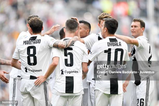 Miralem Pjanic of Juventus celebrates the goal of 2-0 with teammates during the serie A match between Juventus and Hellas Verona FC at Allianz...