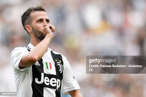 Miralem Pjanic of Juventus celebrates his goal of 2-0 during the serie A match between Juventus and Hellas Verona FC at Allianz Stadium on May 19,...