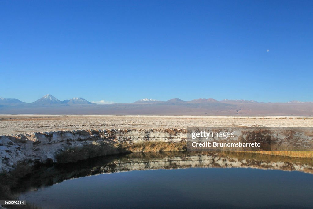 Mountain covered with snow and lake in the Atacama Desert, Chile.