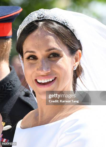 Meghan, Duchess of Sussex leaves Windsor Castle in the Ascot Landau carriage during a procession after getting married at St Georges Chapel on May...