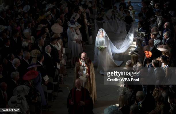 Ms. Meghan Markle walks down the aisle at the start of her wedding to Prince Harry in St George's Chapel at Windsor Castle on May 19, 2018 in...