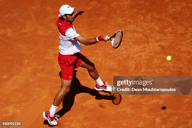Novak Djokovic of Serbia returns a forehand in his semi final match against Rafael Nadal of Spain during day 7 of the Internazionali BNL d'Italia...