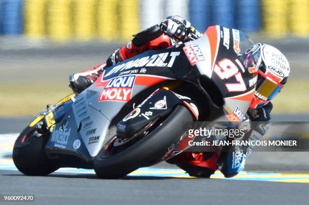 Kiefer Racing Swiss' rider Dominique Aegerter competes and clocked the second place during a Moto2 qualifying session, ahead of the French Motorcycle...