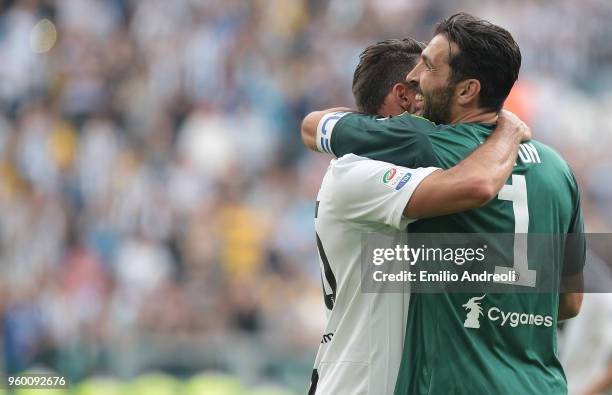 Gianluigi Buffon of Juventus FC embraces Andrea Barzagli of Juventus FC during the serie A match between Juventus and Hellas Verona FC at Allianz...