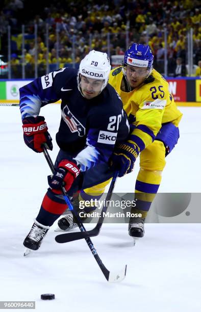 Jacob de la Rosa of Sweden and Chris Kreider of the United States battle for the puck during the 2018 IIHF Ice Hockey World Championship Semi Final...