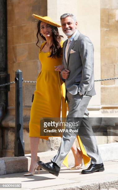 Amal Clooney and George Clooney arrive at St George's Chapel at Windsor Castle for the wedding of Prince Harry and Meghan Markle on May 19, 2018 in...