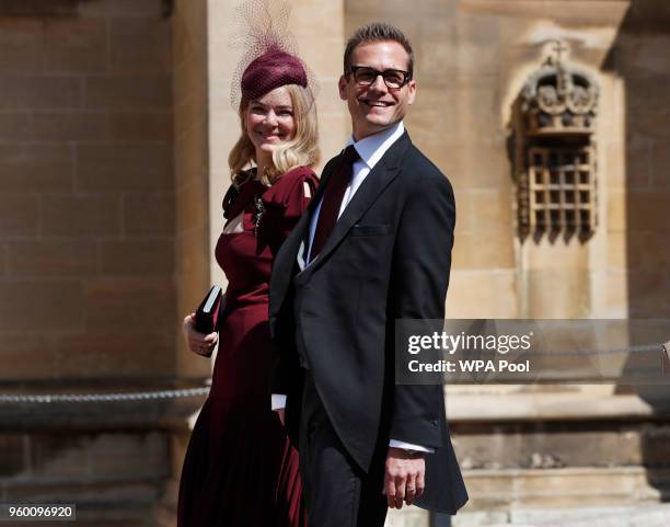 Actor Gabriel Macht and his wife Jacinda Barrett arrive at St George's Chapel at Windsor Castle for the wedding of Prince Harry and Meghan Markle on...