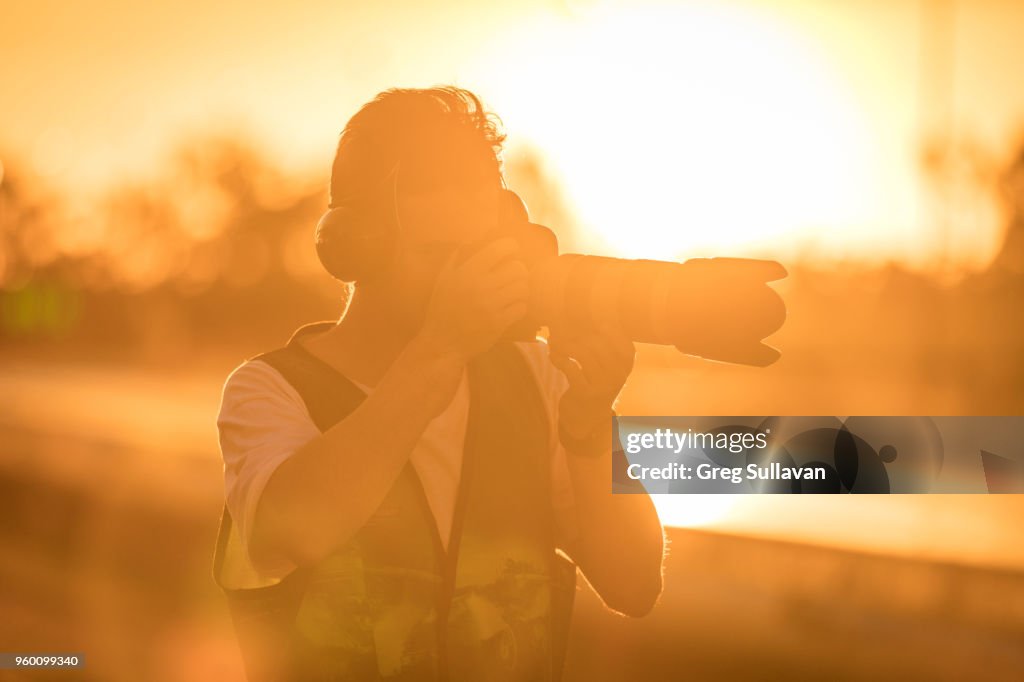 Young sunset photographer