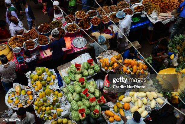 Bangladeshi vendor sells Iftar's items at chawkbazar in the capital Dhaka, Bangladesh on the Second day of Muslim fasting month Ramadan on May 19,...