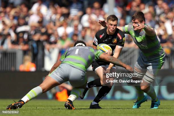 Sam Lockwood of Newcastle Falcons tackles Joe Simmonds of Exeter Chiefs during the Aviva Premiership Semi Final between Exeter Chiefs and Newcastle...