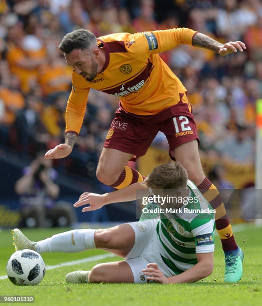 James Forrest of Celtic is challenged by Ryan Bowman of Motherwell during the Scottish Cup Final between Motherwell and Celtic at Hampden Park on May...