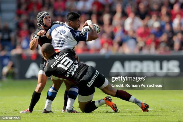 David Smith of Castres is tackled by Gael Fickou of Toulouse during the French Top 14 match between Stade Toulousain and Castres at Stade Ernest...