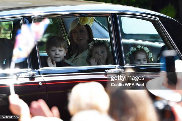 Catherine, Duchess of Cambridge arrives with bridesmaids Princess Charlotte , Florence van Cutsem and page boy Jasper Dyer at St George's Chapel,...