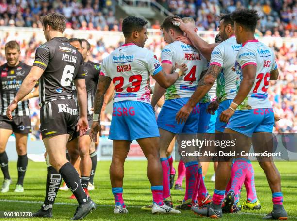 St Helens' Mark Percival celebrates with teammates after scoring his side's second try during the Betfred Super League Round 15 match between Widnes...