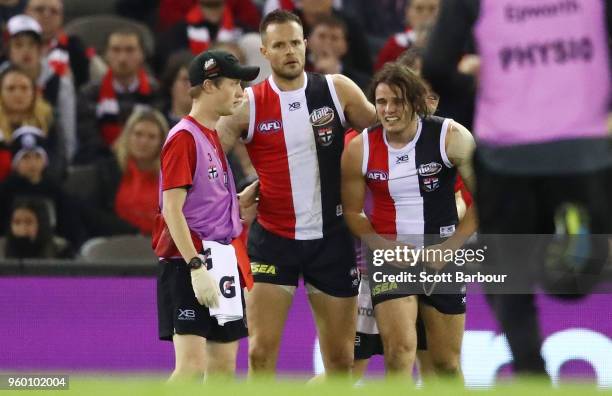 Nathan Brown of the Saints leaves the field injured during the round nine AFL match between the St Kilda Saints and the Collingwood Magpies at Etihad...