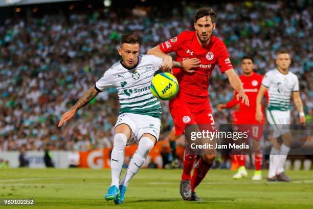 Brian Lozano of Santos and Santiago Garcia of Toluca fight for the ball during the Final first leg match between Santos Laguna and Toluca as part of...