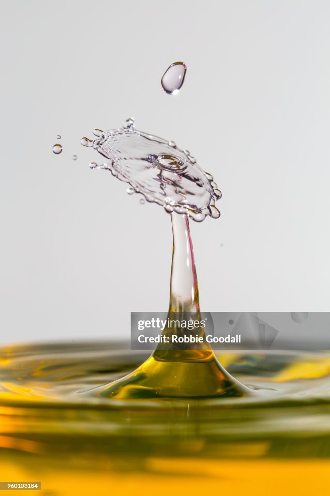 Water drip on a grey backdrop