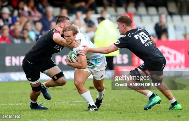 Sharks' Stephan Lewies and Jacques Vermuelen tackle Chiefs' Matt Matich during the SUPER XV Rugby Union match between Durban's Sharks and New...
