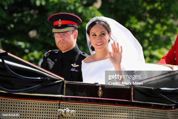 Prince Harry, Duke of Sussex and Meghan, Duchess of Sussex leave Windsor Castle in the Ascot Landau carriage during a procession after getting...