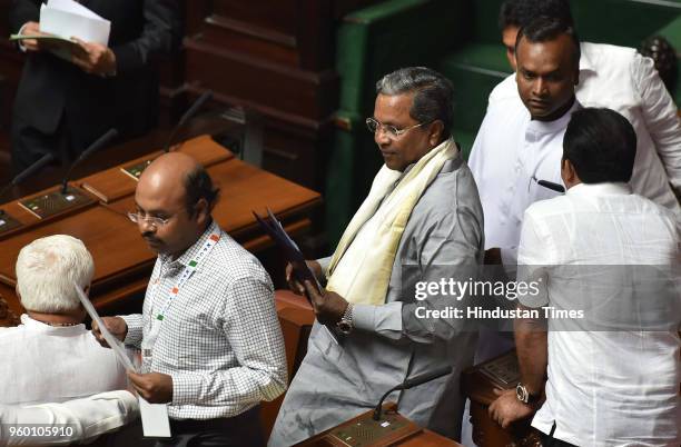 The outgoing Chief Minister of Karnataka Siddaramaiah with his son Jatindra during a special session to prove majority by BJP at Vidhana Soudha, on...