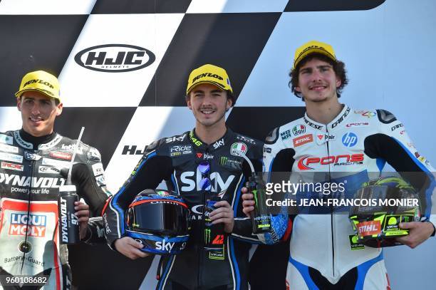 Second placed Kalex Dynavolt Intact GP Spanish's rider Xavier Vierge , Kalex Sky Racing Team VR46 Italian's rider Francesco Bagnaia and third placed...