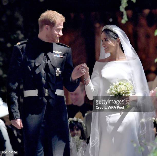 Prince Harry and Meghan Markle walk along the aisle of St George's Chapel after their wedding in St George's Chapel at Windsor Castle on May 19, 2018...