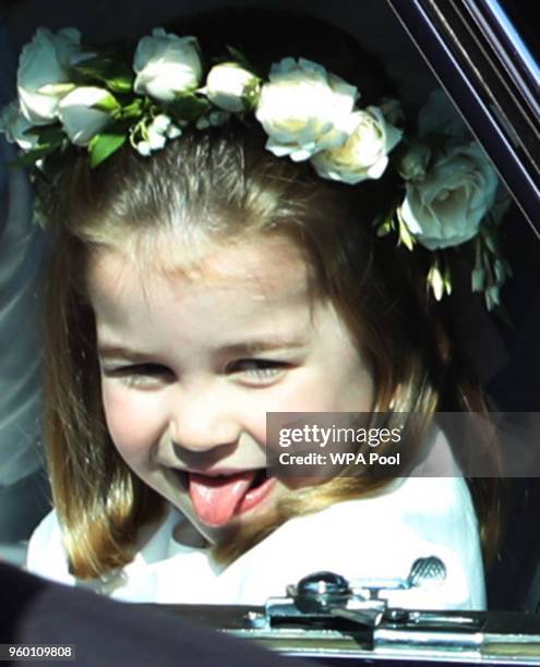 Princess Charlotte rides in a car to the wedding of Prince Harry and Meghan Markle at St George's Chapel in Windsor Castle on May 19, 2018 in...