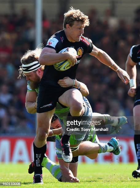Lachie Turner of Exeter Chiefs is tackled by Evan Olmstead of Newcastle Falcons during the Aviva Premiership Semi Final between Exeter Chiefs and...