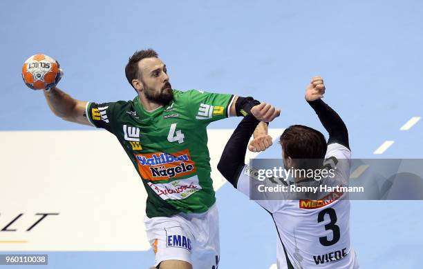 Tim Kneule of Goeppingen and Fabian Wiede of Fuechse Berlin compete during the Ottostadt Magdeburg EHF Cup Final Four 2018 Semifinal match between...