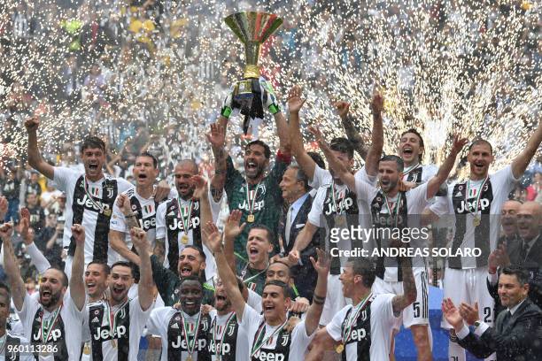 Juventus' goalkeeper from Italy Gianluigi Buffon lifts the trophy during the victory ceremony following the Italian Serie A last football match of...