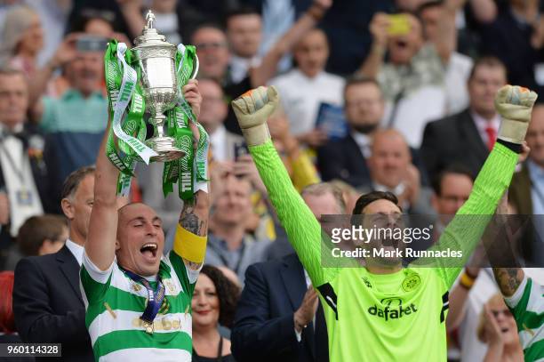 Scott Brown of Celtic holds the Scottish Cup Trophy following his side's win at the Scottish Cup Final between Motherwell and Celtic at Hampden Park...