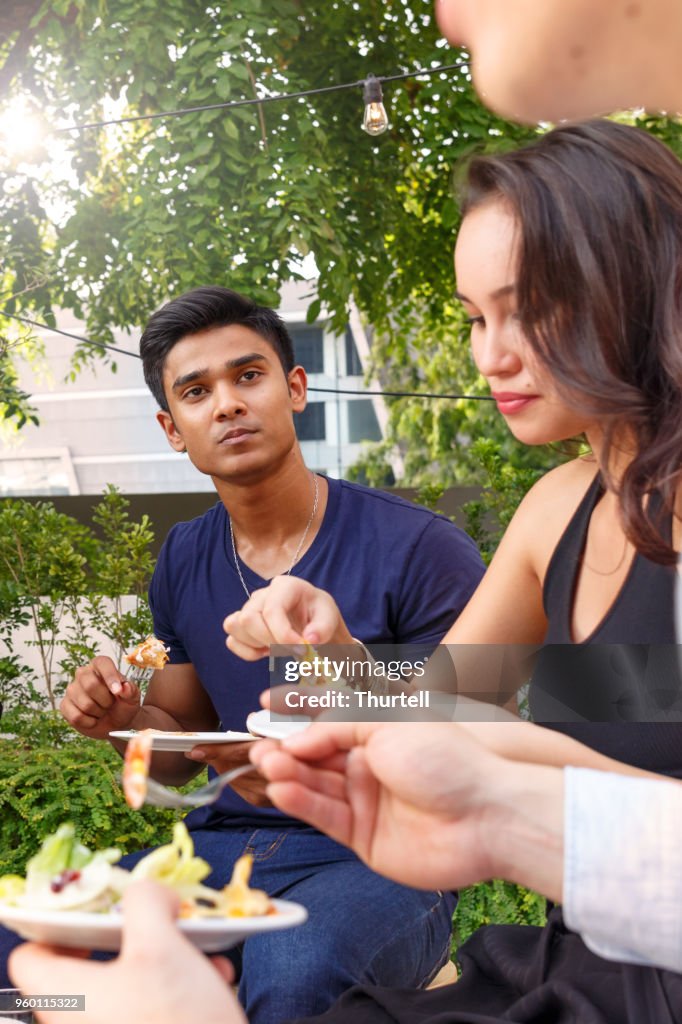 Asian Friends Enjoying Outdoor Roof Top Party