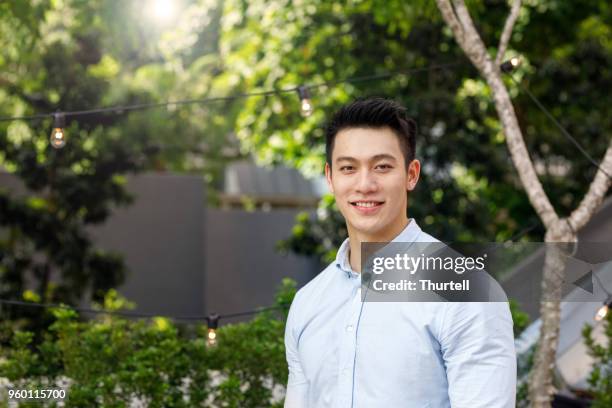 portrait of young asian man - asian man stock pictures, royalty-free photos & images