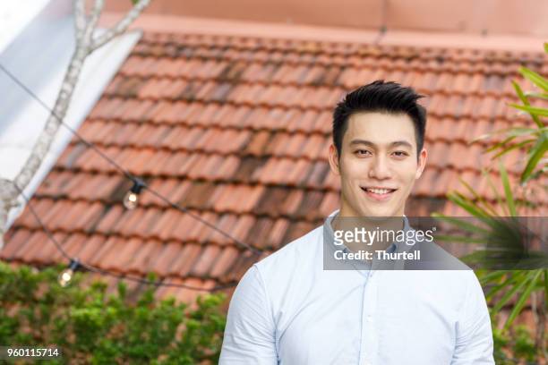 portrait of young asian man - 20 29 years stock pictures, royalty-free photos & images
