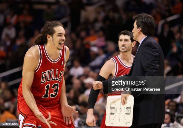 Joakim Noah and Kirk Hinrich of the Chicago Bulls celebrate after scoring with head coach Vinny Del Negro during the NBA game against the Phoenix...